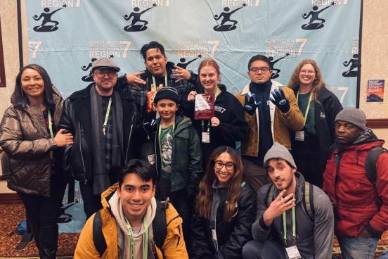 Group photo in front of banner