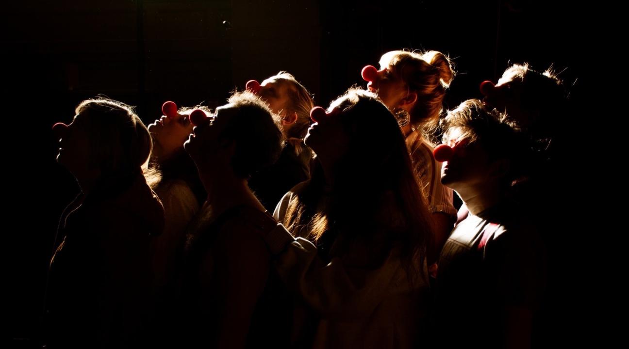 Group of silhouetted clowns