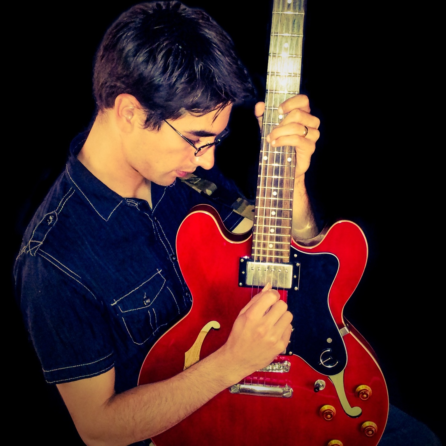 Enrique Rojas playing guitar