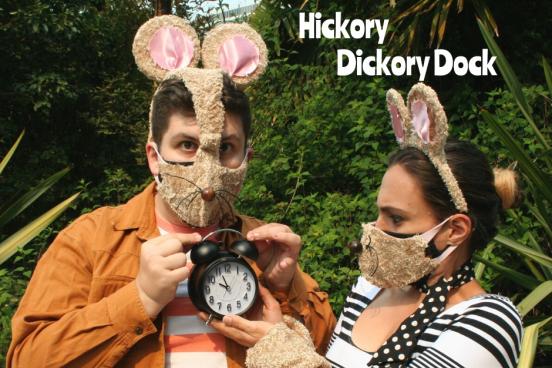 Hickory Dickory Dock with two actors dressed in mouse costumes and one holding a clock