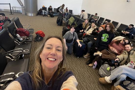 Kristen Daley taking a selfie with dancers in the airport