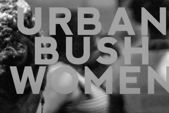 Urban Bush Women with back of head of hair in black and white