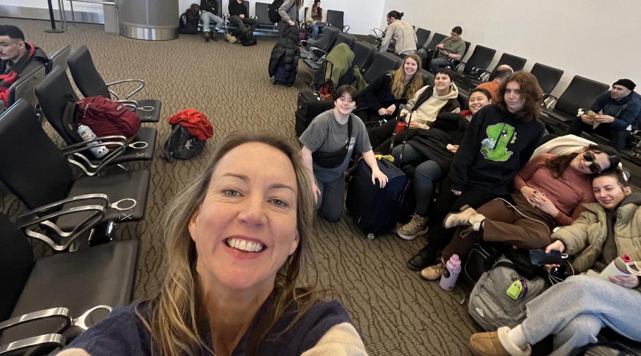 Kristen Daley taking a selfie with dancers in the airport