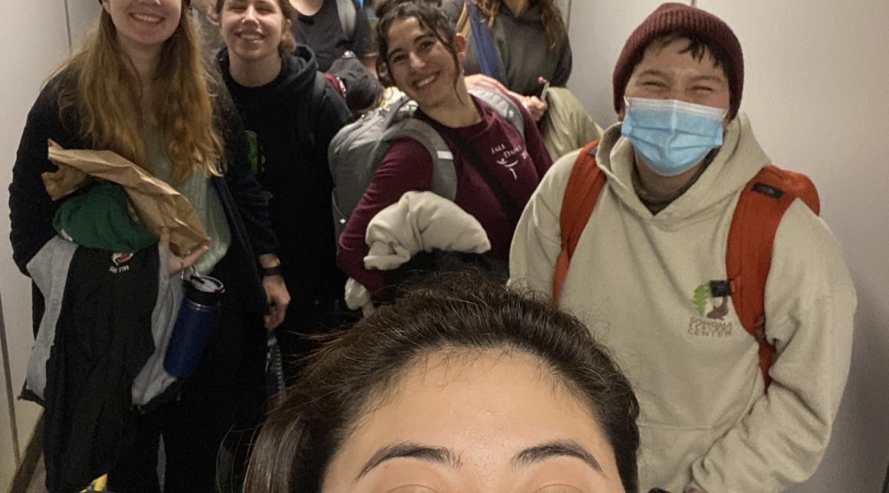 Farrah McAdam taking a selfie with dancers boarding airplane