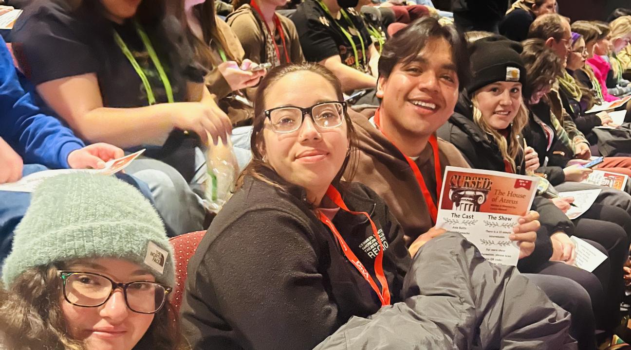 Students sitting in theatre seats