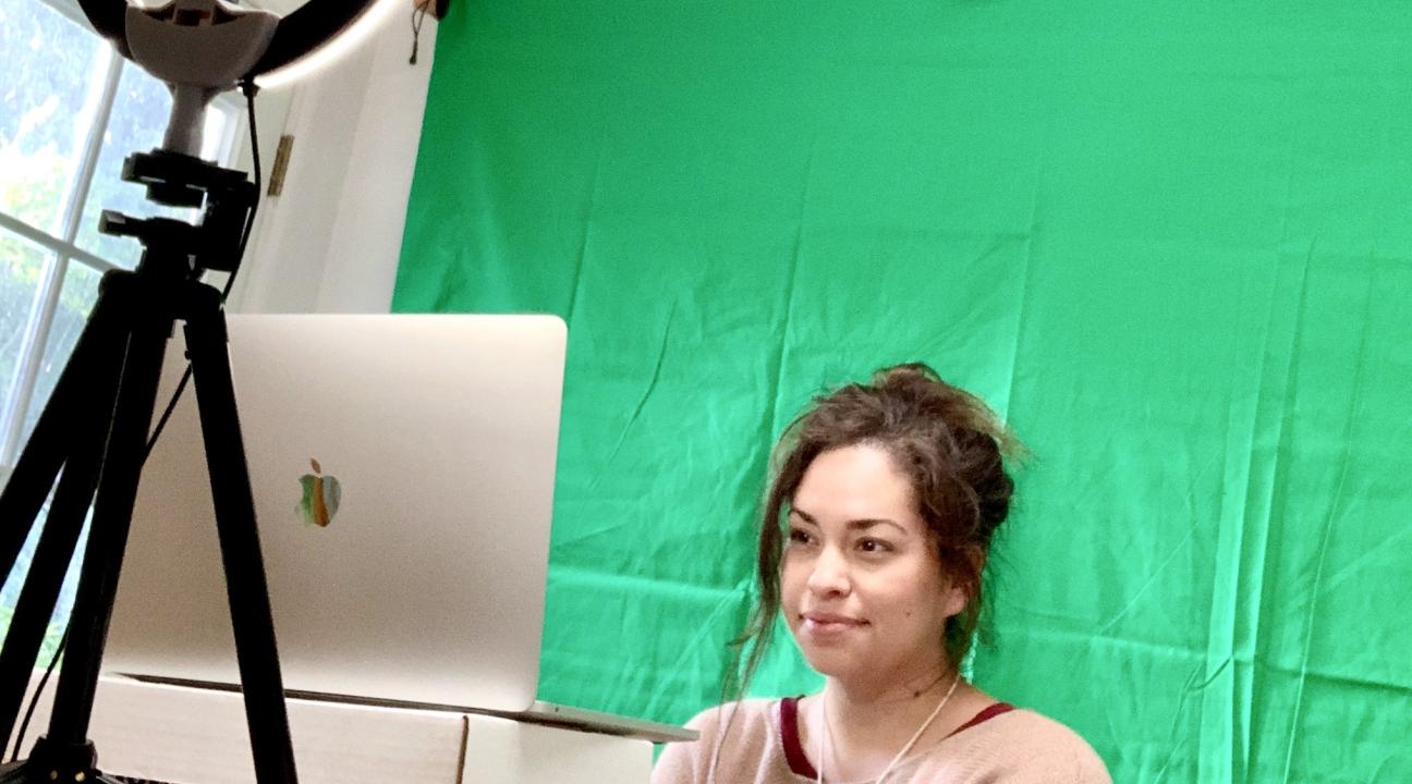 Rosemarie Kingfisher in front of a light and computer