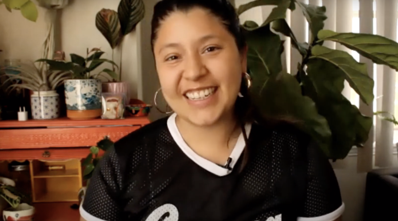 Screenshot of Noelle Dominique Rodriguez in her own home smiling