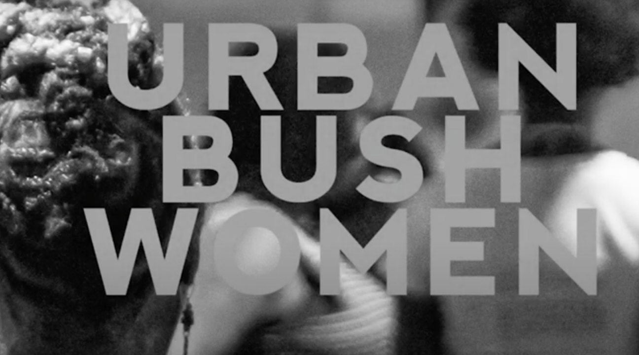 Urban Bush Women with back of head of hair in black and white