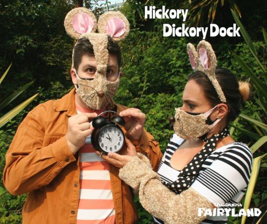 Hickory Dickory Dock with two actors dressed in mouse costumes and one holding a clock