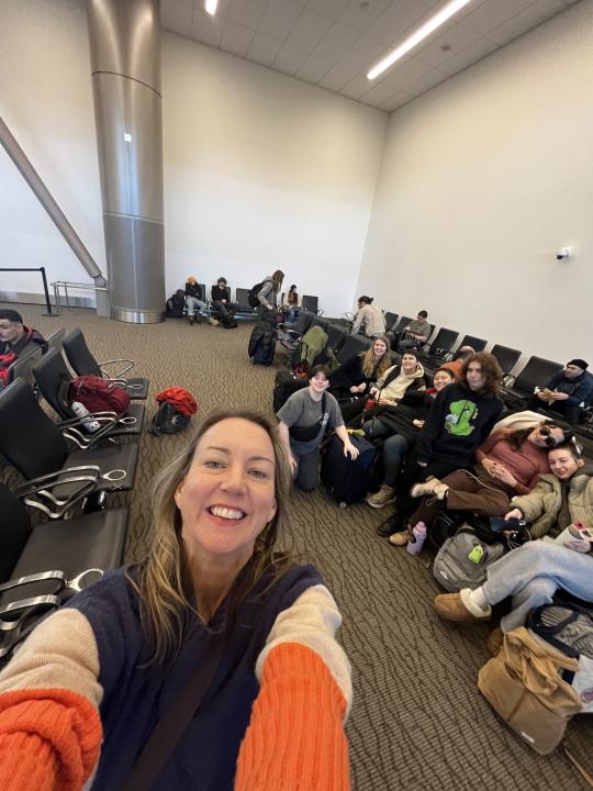 Kristen Daley taking a selfie with dancers in the airport