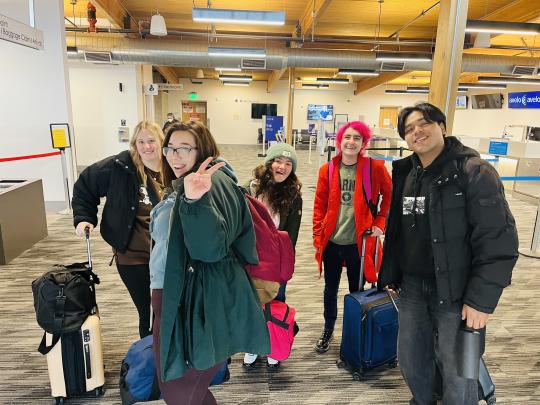 Students at airport ready to go